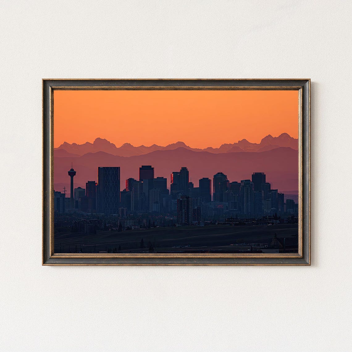 Calgary Skyline Silhouette at Orange Sunset with Rockies Poster
