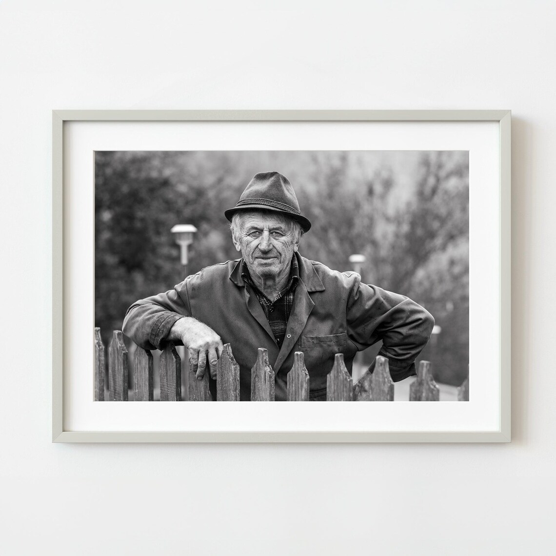 Black And White Portrait Of A Weathered Farmer Leaning On Fence Wall Art
