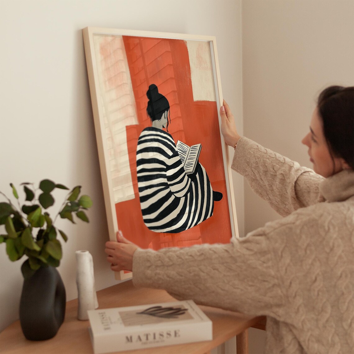 Woman in Striped Robe Reading Against Terracotta Minimalist Art Poster - Image 2