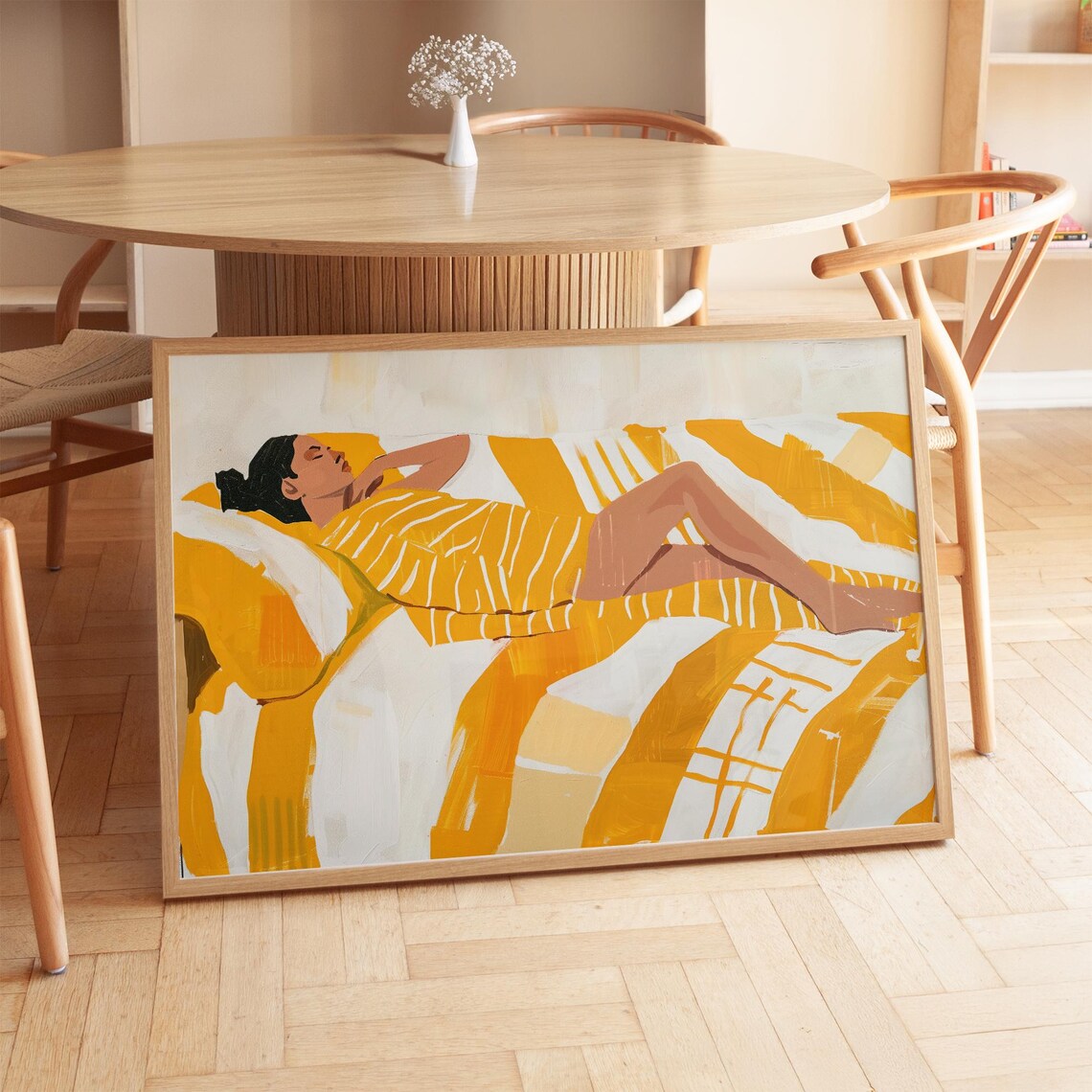 Relaxed Woman Lounging in Warm Yellow Striped Bedding Poster