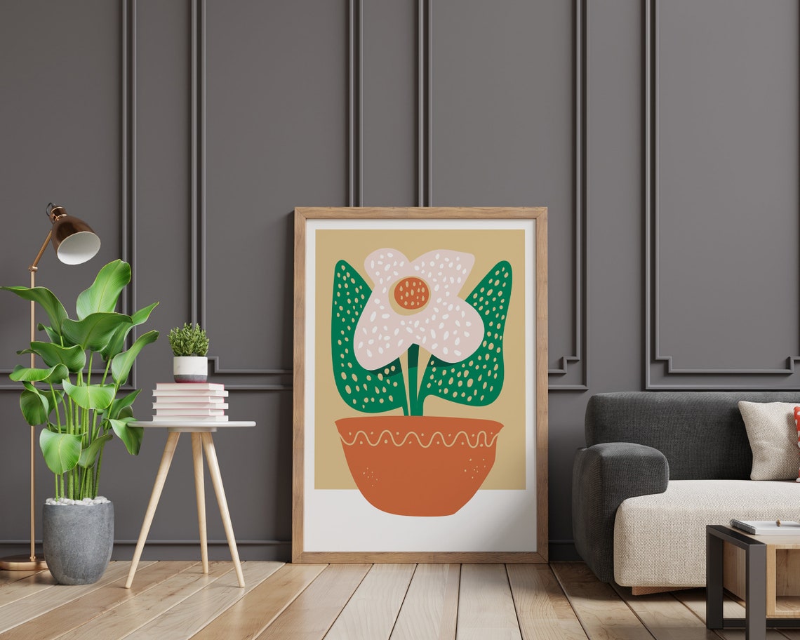 White Dotted Flower in Orange Pot Green Leaves Graphic Poster - Image 2