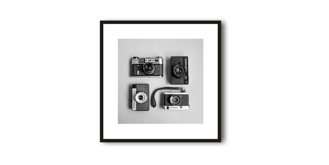 Collection of Four Vintage Cameras Flat Lay Black White Poster