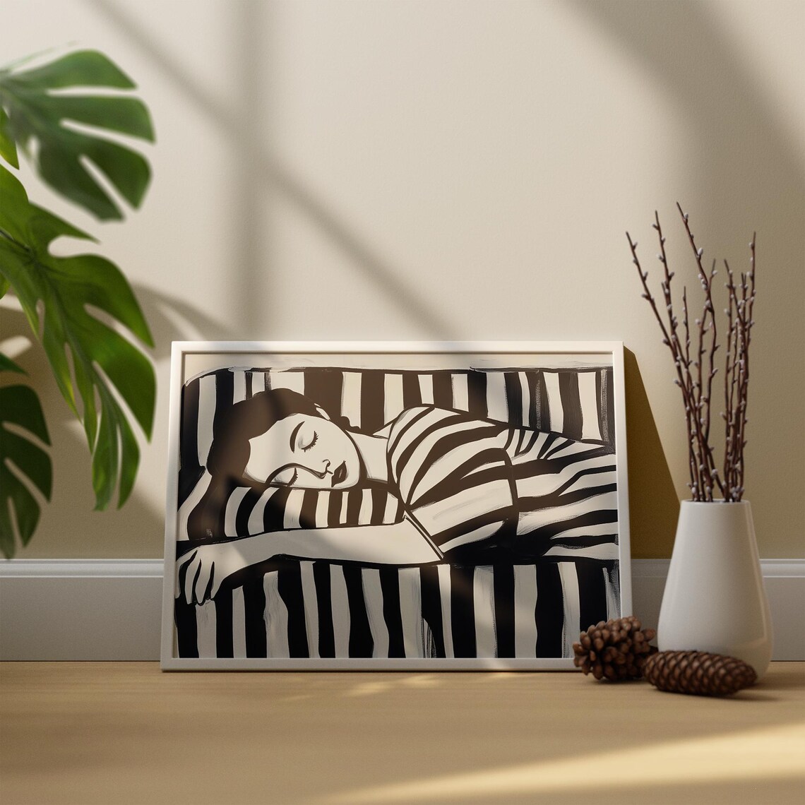 Reclining Monochrome Woman Sleeping Wrapped In Bold Stripes Print - Image 2