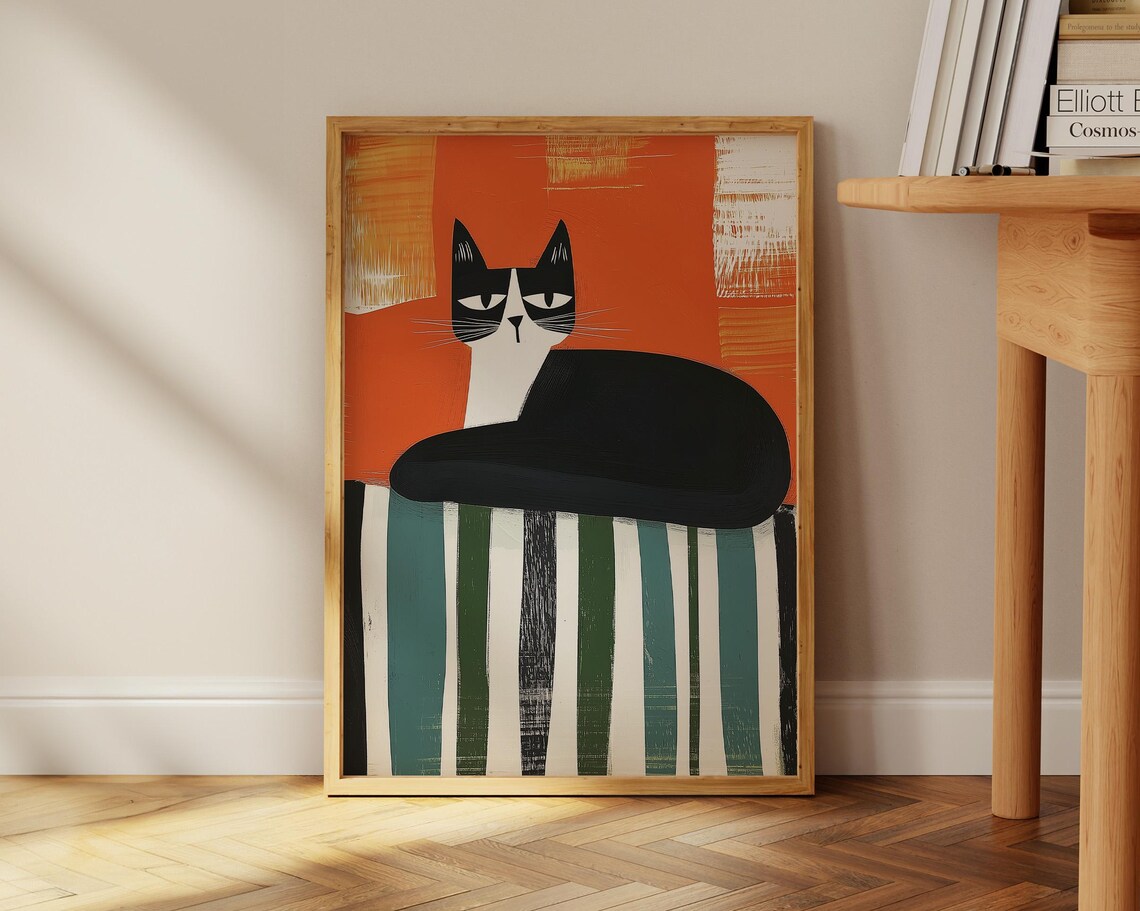 Bold Black And White Cat On Striped Fabric With Orange Poster - Image 2