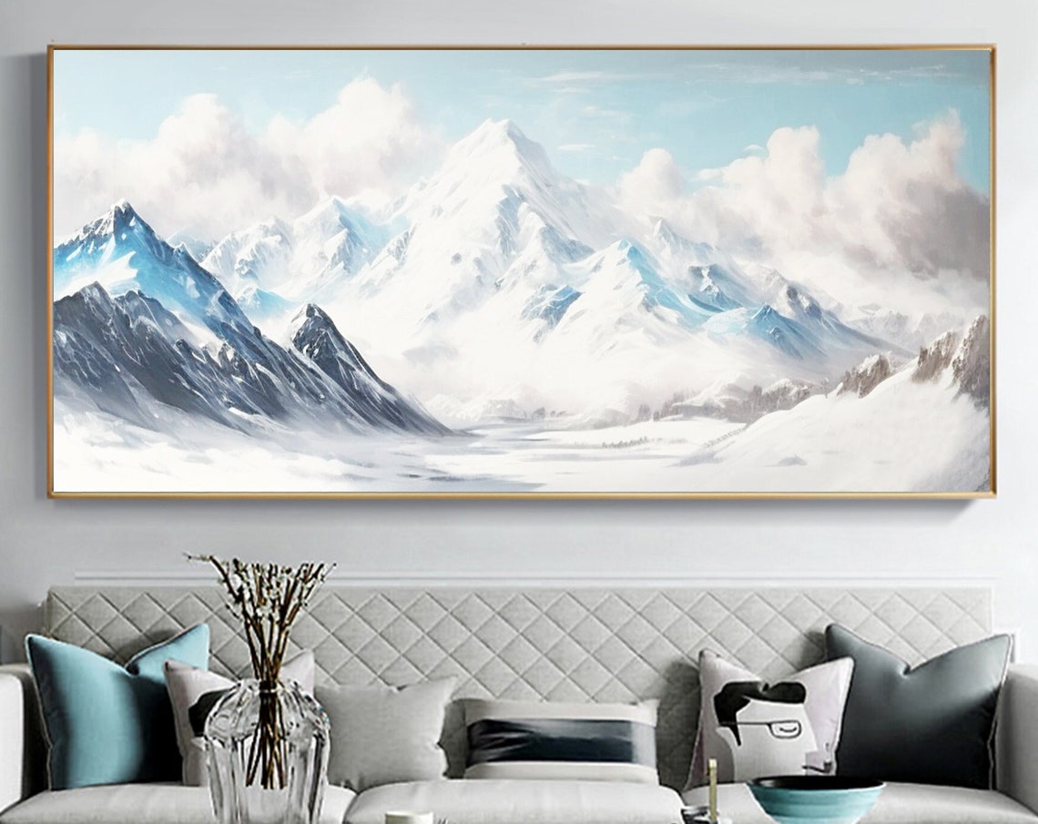 Snow Capped Alpine Mountain Peaks Under Soft Blue Clouds Poster