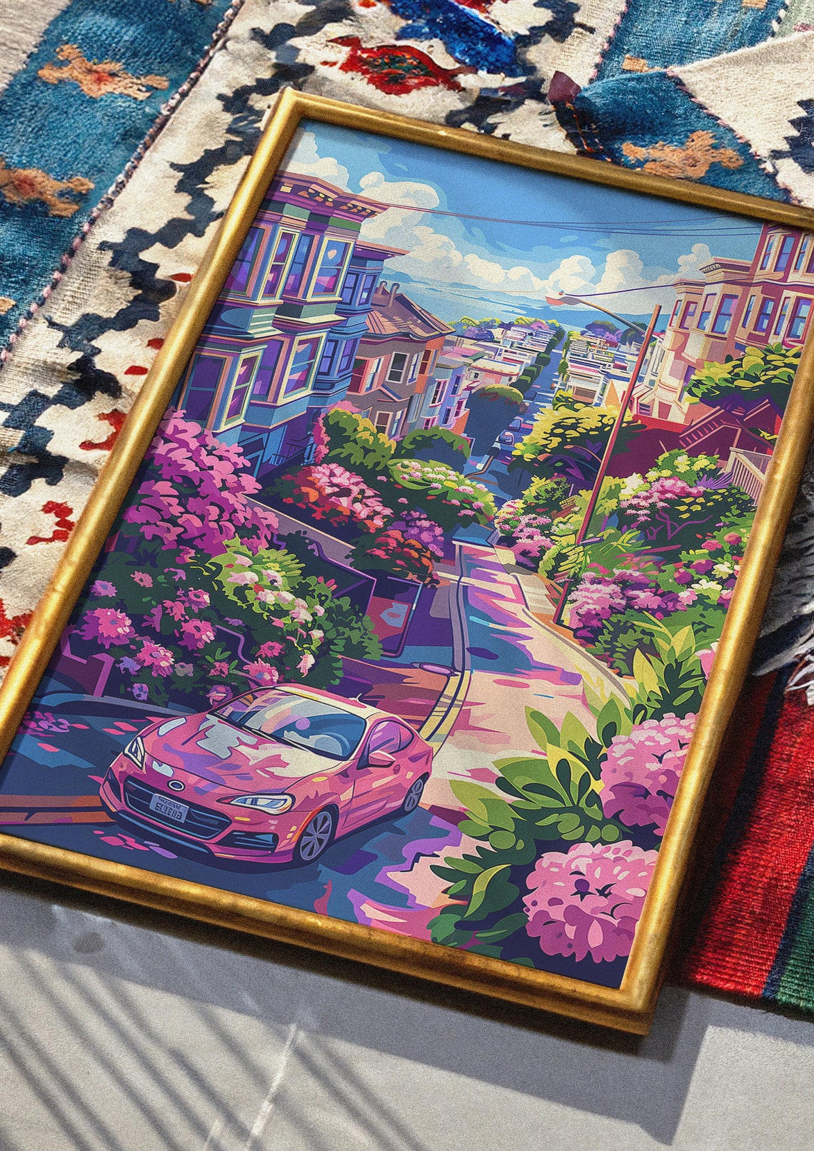 Joyful Hilly City Street with a Pink Car and Blooming Flowers Poster - Image 3