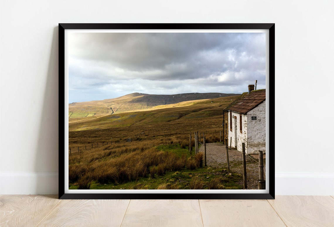 Weathered Stone Bothy Standing Alone on a Windswept Moorland Poster