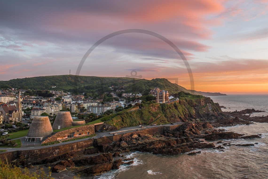 Ilfracombe Devon Sunset Over Cliff Town And Rocky Coastline Poster - Image 3