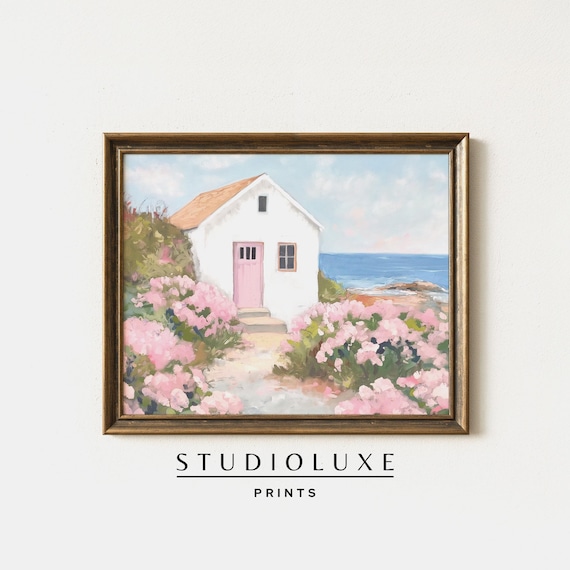 White Cottage With Pink Door And Pink Hydrangeas By The Sea Poster