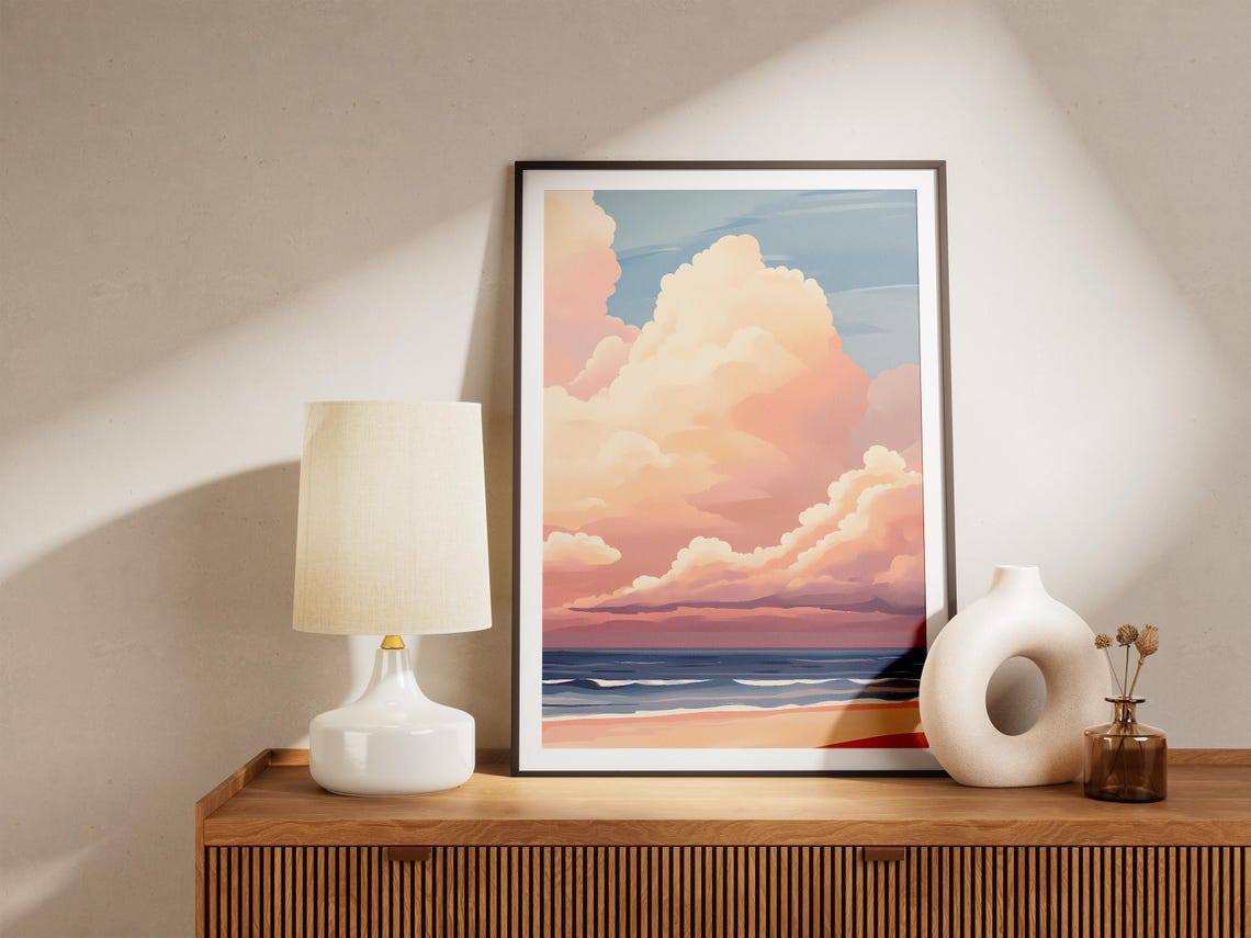 Pastel Clouds Towering Over a Peaceful Sunset Beach Shore Poster - Image 5