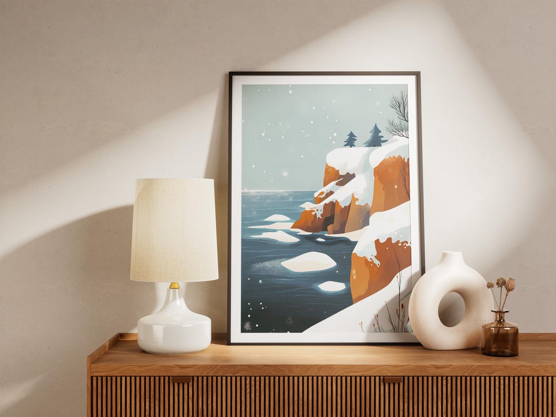 Snowy Orange Cliffs Along a Deep Blue Sea in Falling Snow Poster - Image 5