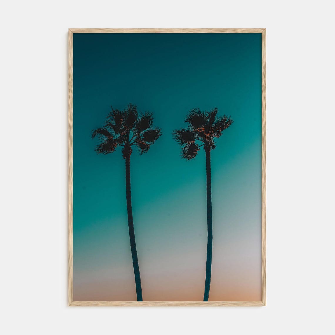 Two Palm Silhouettes Against a Teal to Pink Gradient Dusk Sky Poster