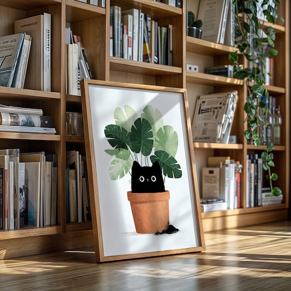 Cute Black Cat Peeking Out of a Terracotta Pot With Green Leaves Poster