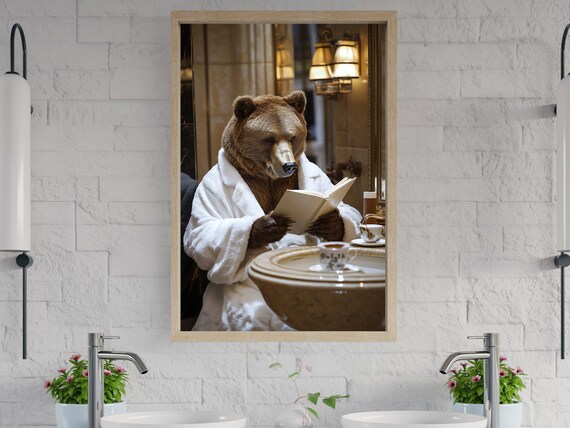 Brown Bear in a Bathrobe Reading a Book Beside the Sink Poster