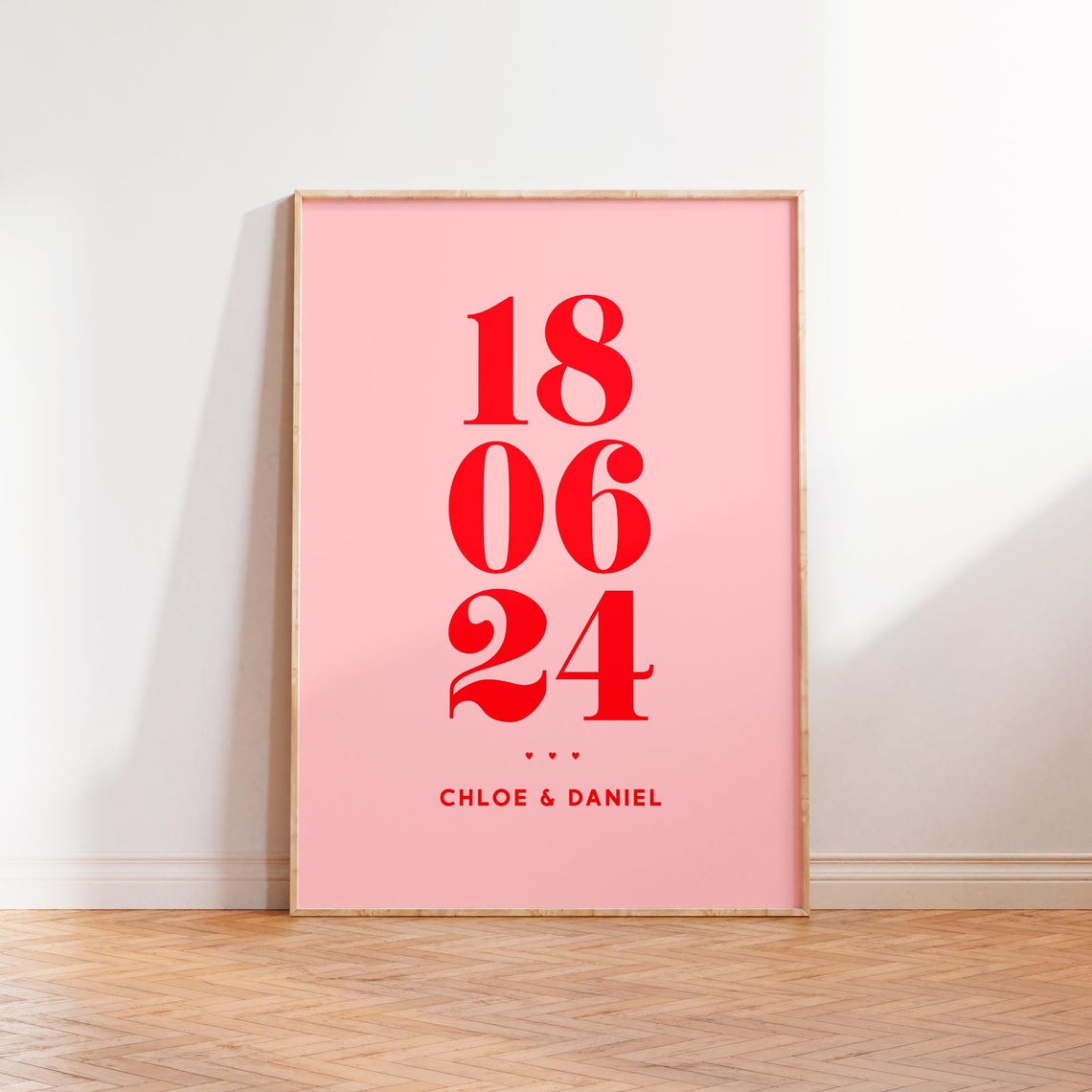 Chloe And Daniel Personalised Date Poster In Red Serif On Pink