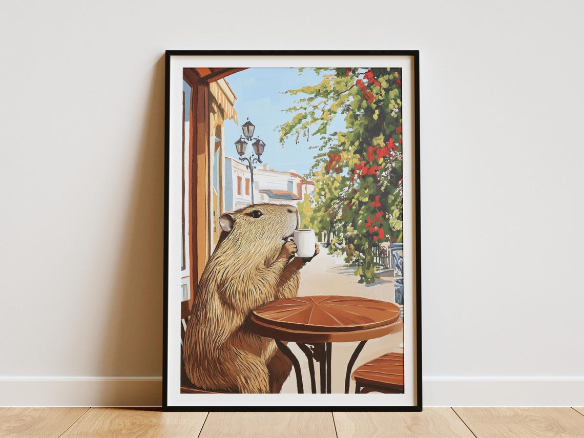 Capybara Drinking from a Mug at a Flower Lined Street Cafe Poster