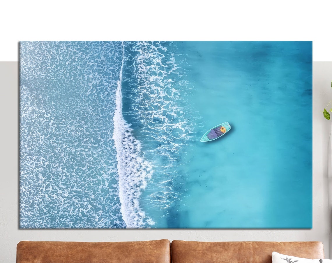 Aerial View Of Lone Boat On Turquoise Sea With Foamy Waves Wall Art