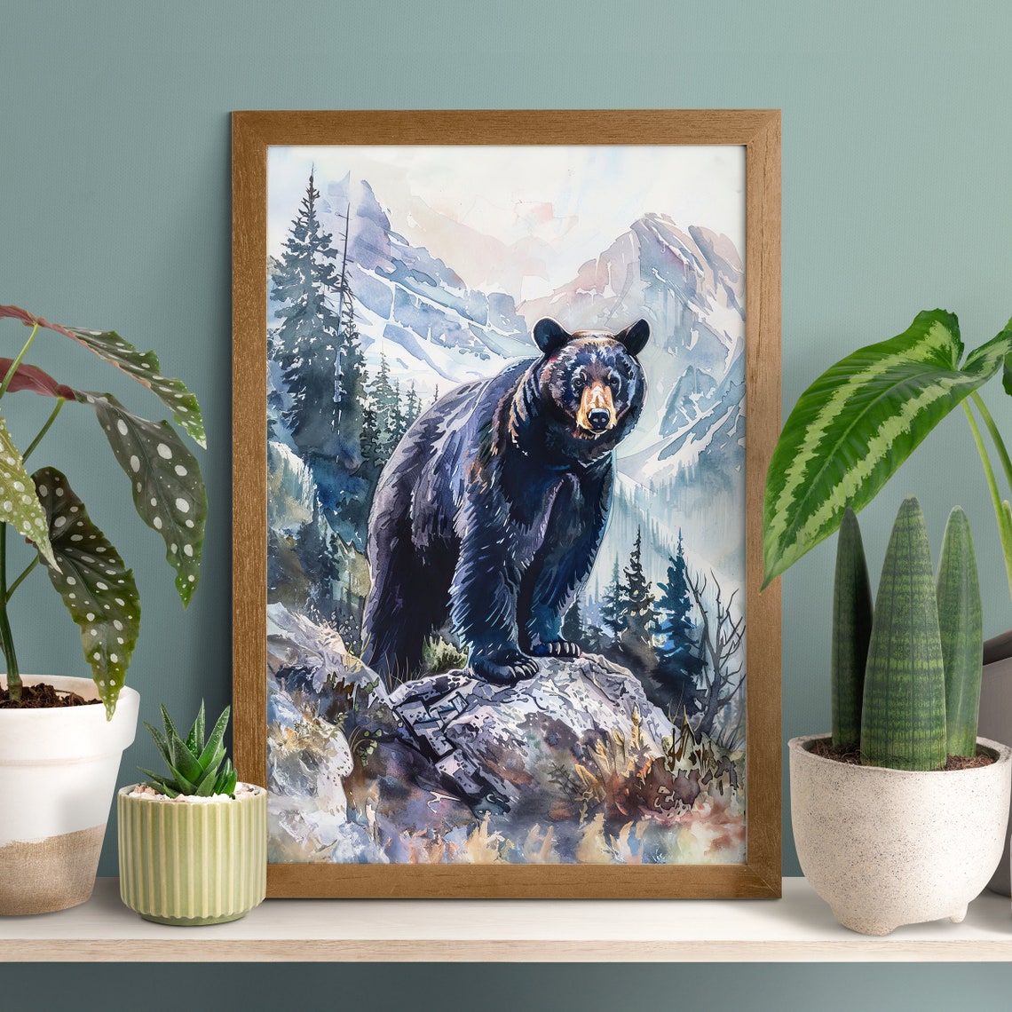 Majestic Black Bear Standing on a Rock in Snowy Mountains Poster