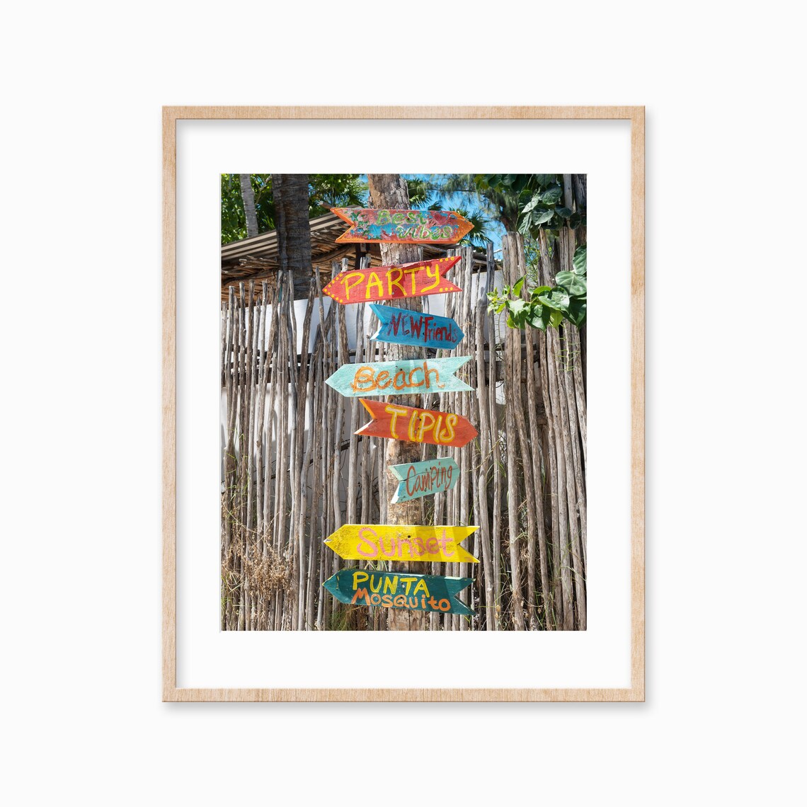 Colorful Hand Painted Wooden Direction Signs at a Beach Spot Poster