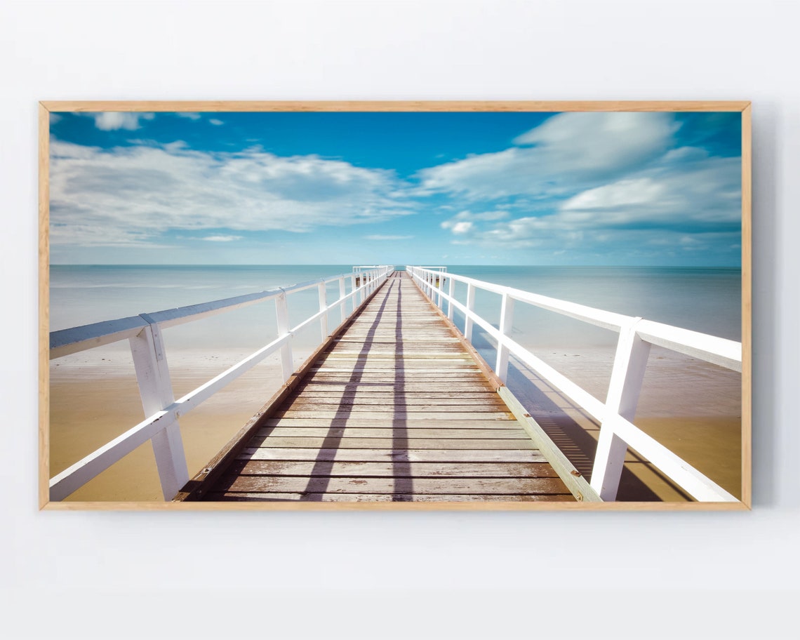 Wooden Ocean Pier Long Boardwalk Under Blue Sky Calm Sea Poster