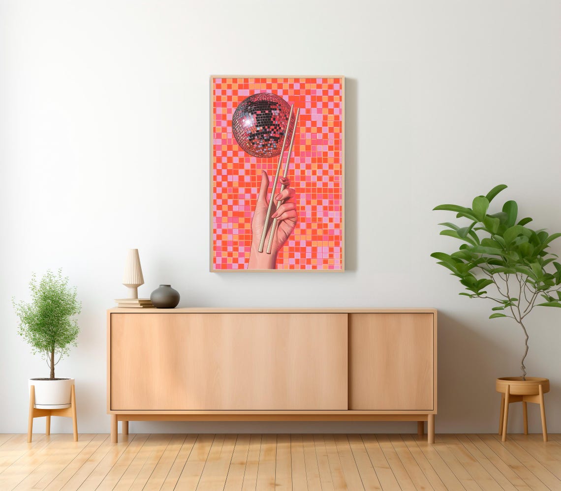 Disco Ball Lifted by Chopsticks on a Pink and Orange Pixel Grid Poster - Image 2