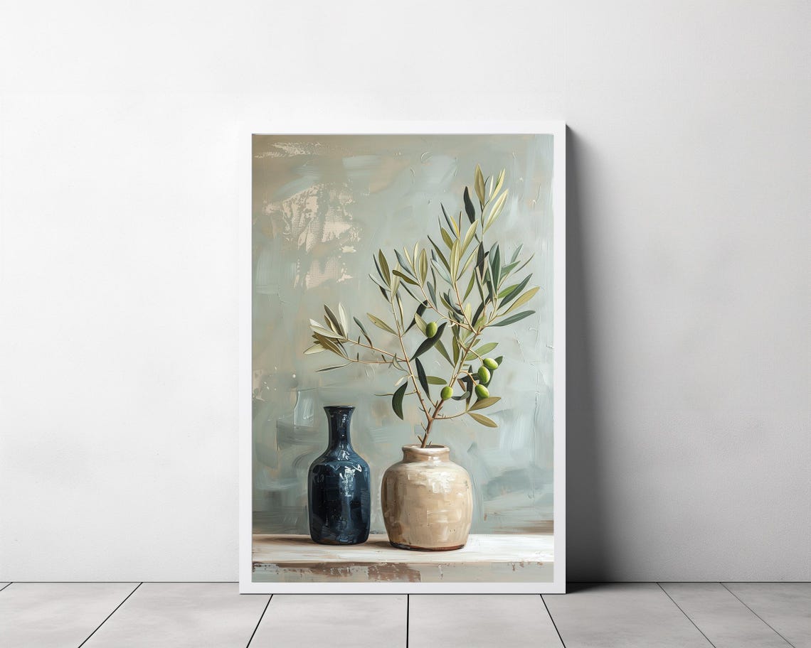 Single Olive Branch in a Ceramic Vase Beside a Blue Bottle Poster - Image 3