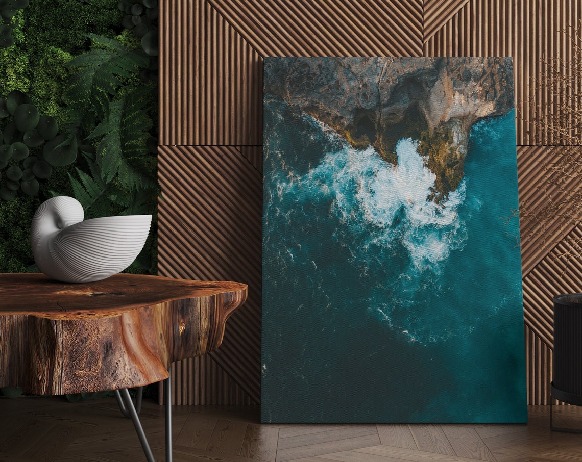 Aerial View of Turquoise Ocean Waves Crashing on Rocky Coast Poster