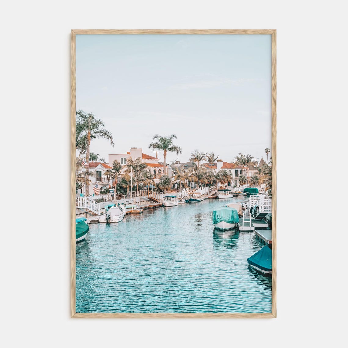 Sunlit Marina Canal with Palm Trees and Boats Coastal Poster