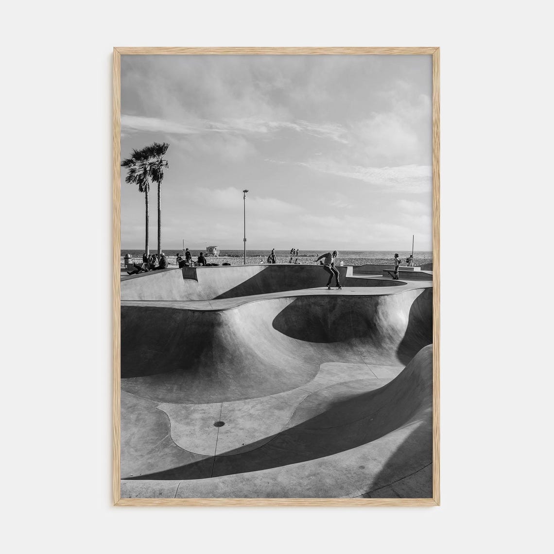 Black and White Beachfront Skatepark Scene With Skaters Poster