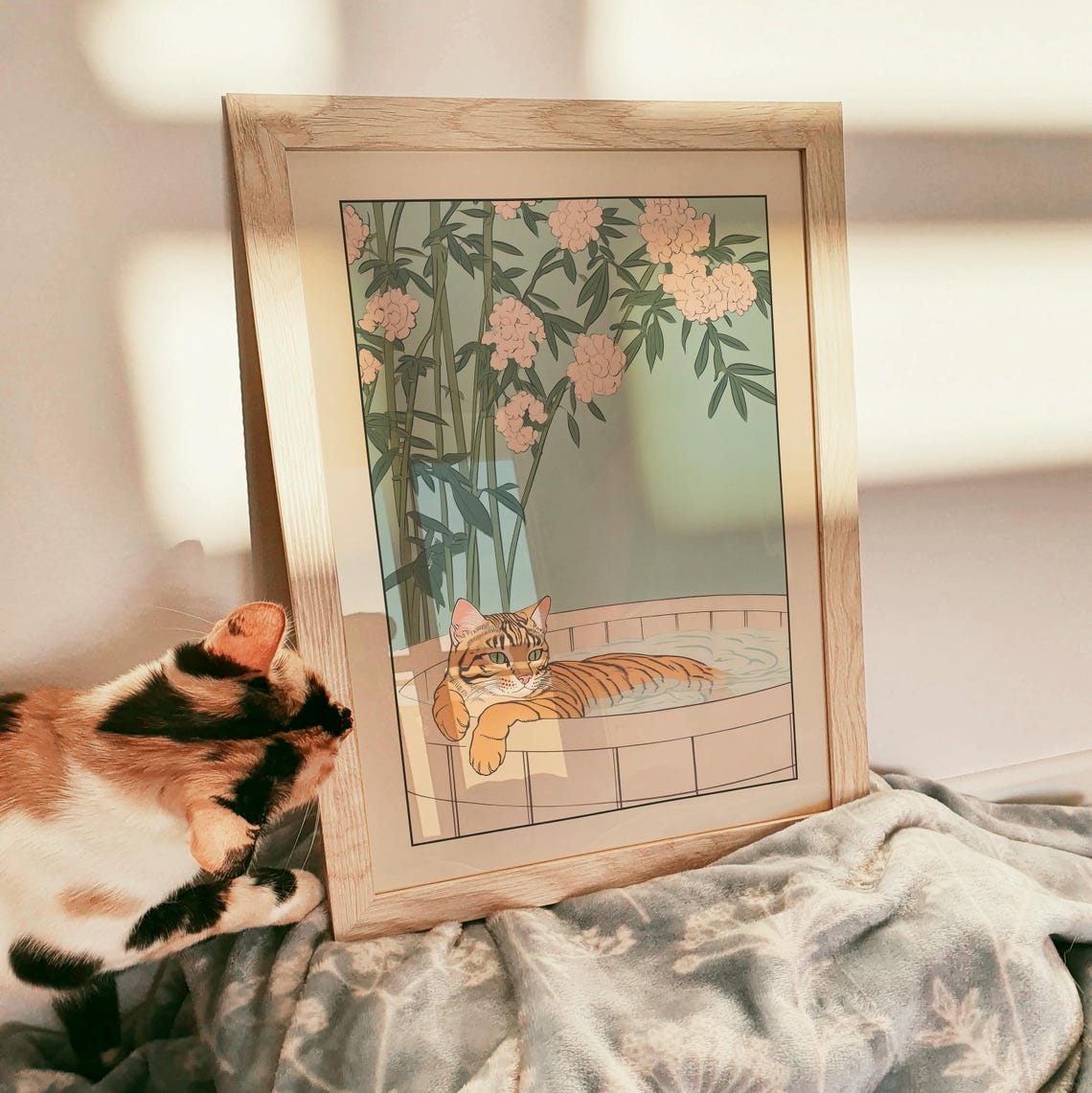Bengal Cat Relaxing in Bath Under Pink Blossom and Bamboo Poster - Image 3