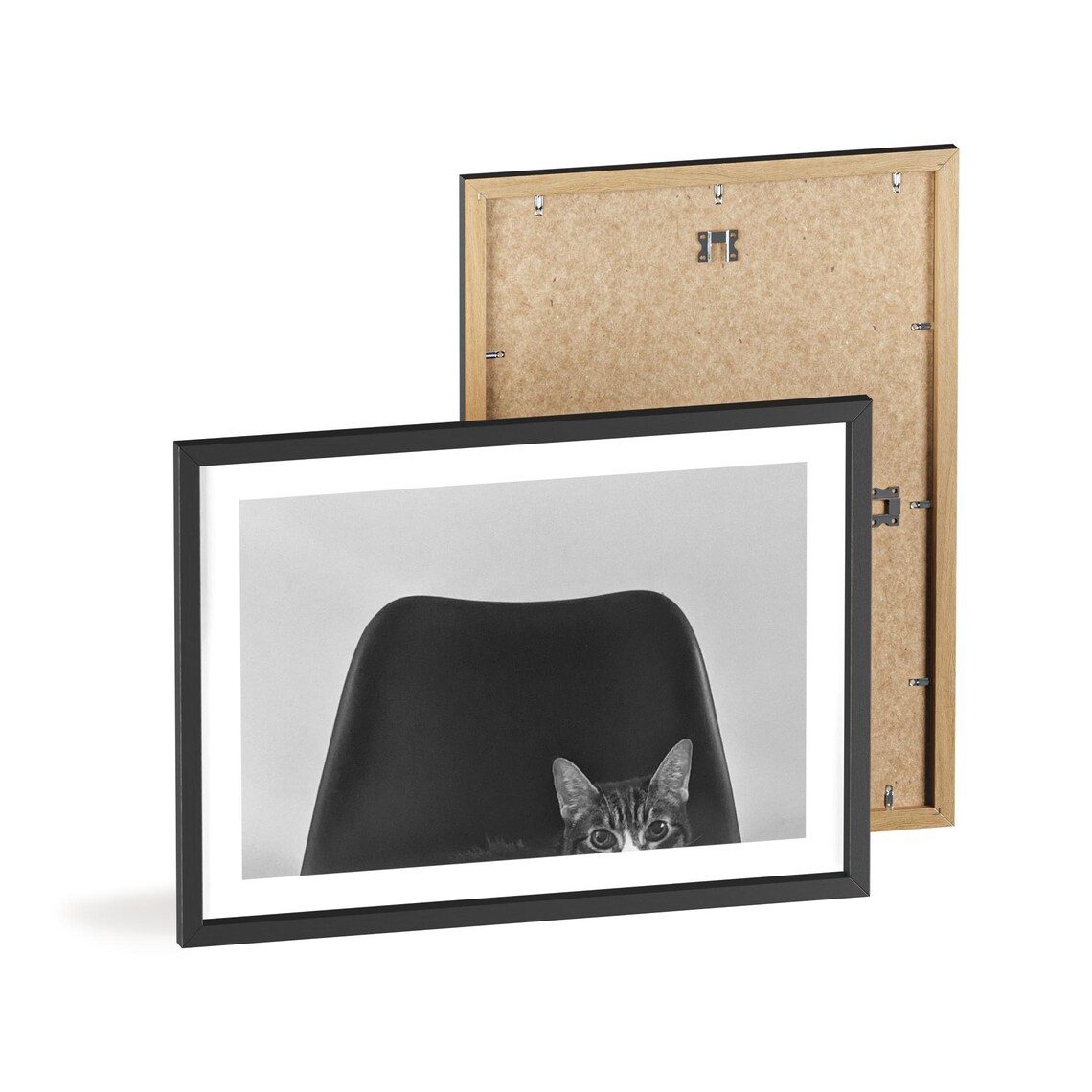 Tabby Cat Peeking Behind Black Chair Photography Wall Poster - Image 2