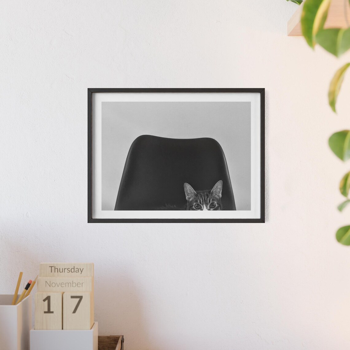 Tabby Cat Peeking Behind Black Chair Photography Wall Poster - Image 3