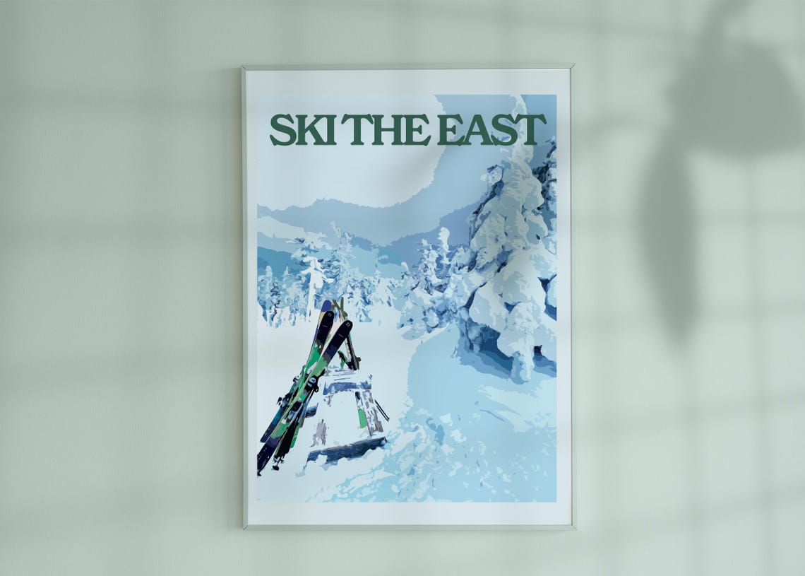 Ski The East Green Lettering Skis Resting in Snowy Pine Forest Poster