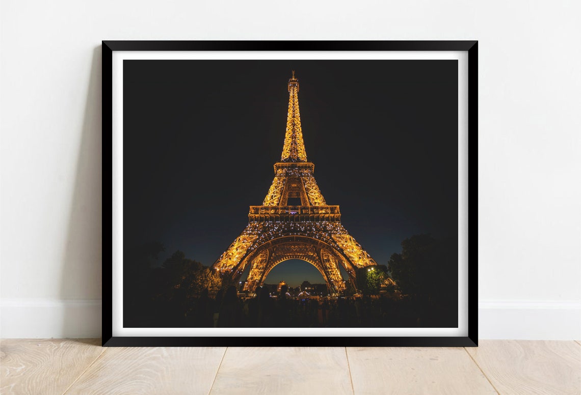 Eiffel Tower Illuminated in Gold Lights at Night in Paris Poster