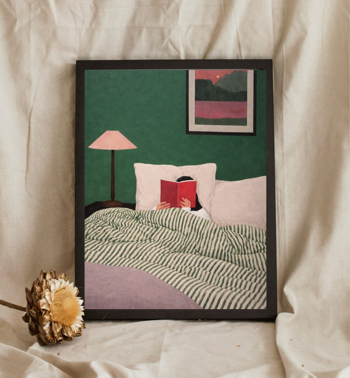 Girl Reading In Bed With A Red Book Under Cozy Striped Duvet Poster
