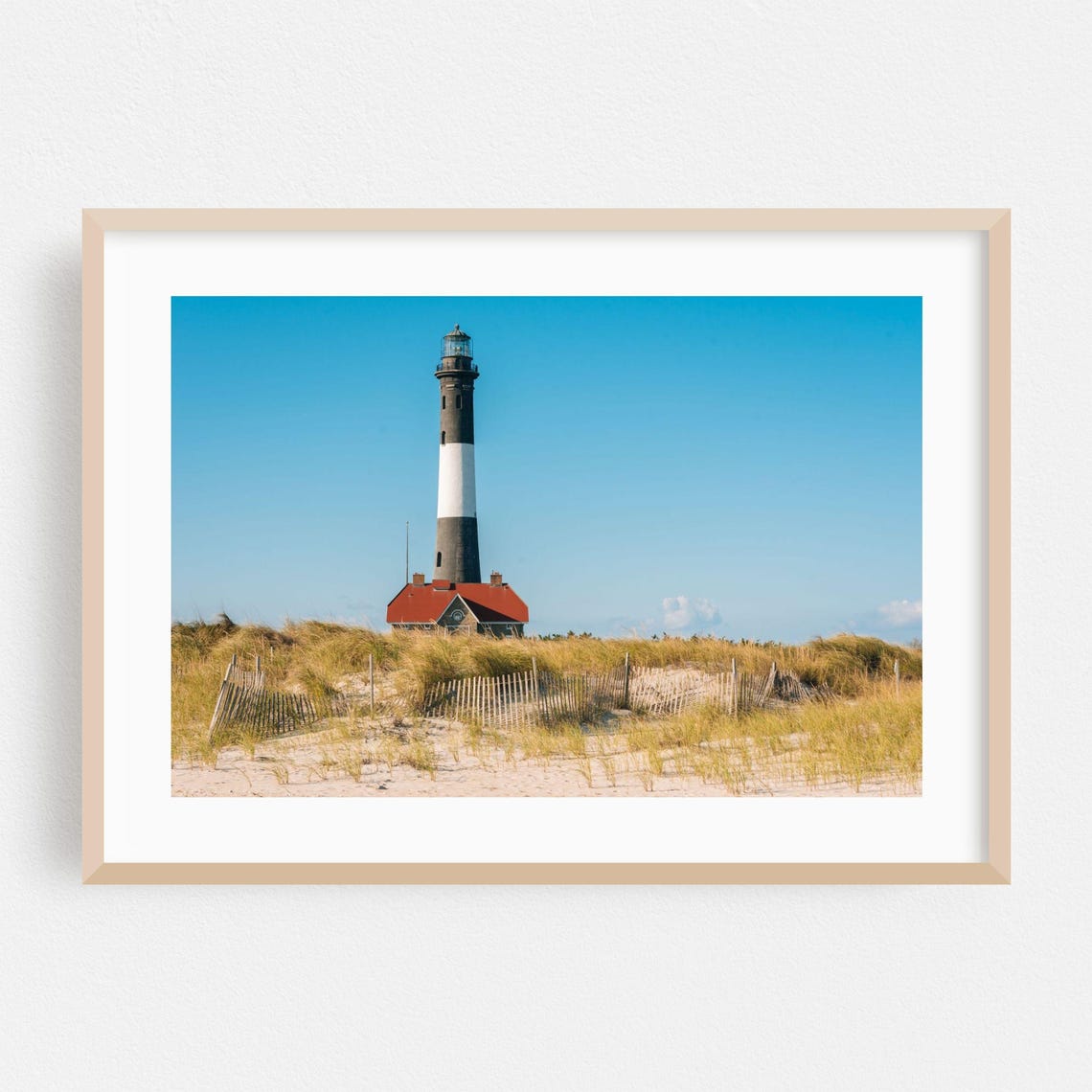Classic Black and White Striped Lighthouse on Sandy Dunes Poster