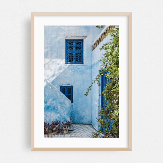 Blue-Washed Moroccan Courtyard With Ornate Window Grilles Poster