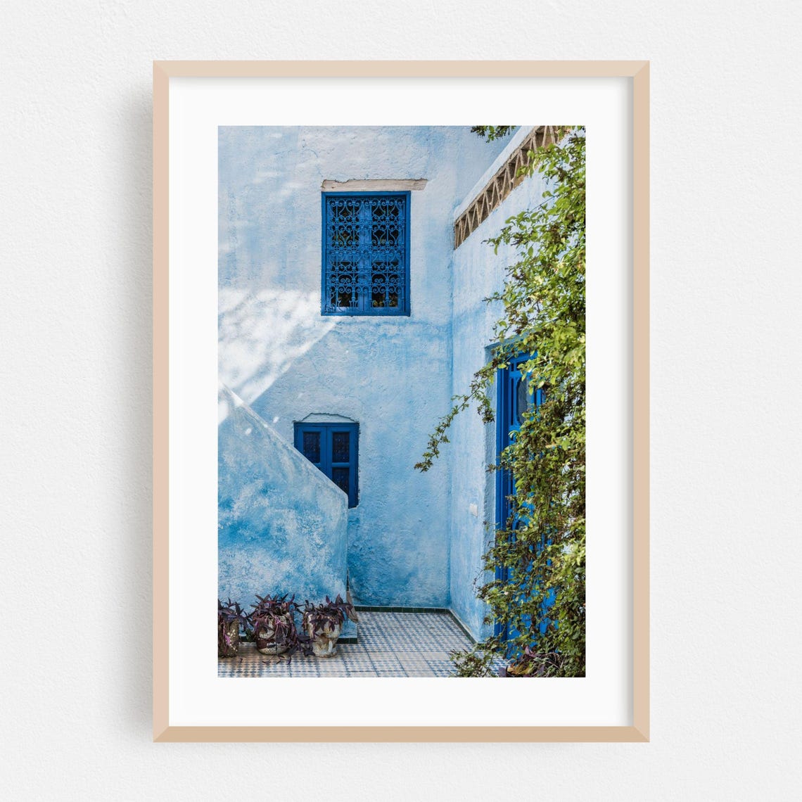 Blue-Washed Moroccan Courtyard With Ornate Window Grilles Poster