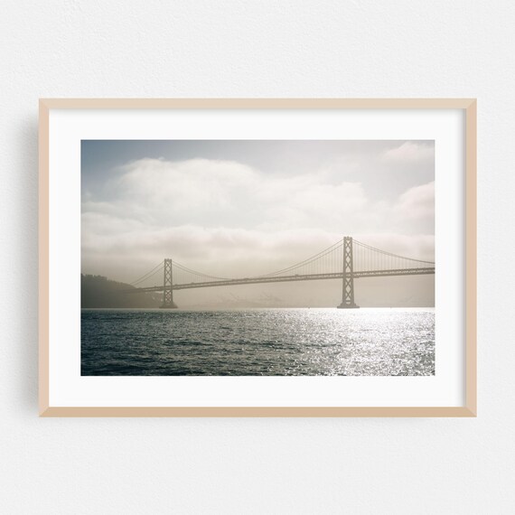 San Francisco Bay Bridge In Fog Over Sparkling Harbor Water Poster