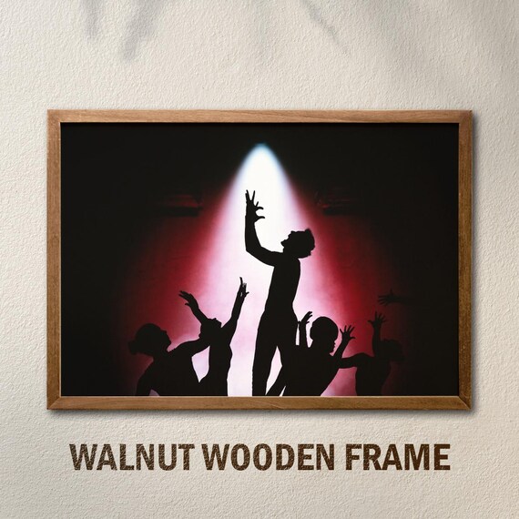 Dancer Silhouettes Under Red Spotlight Dramatic Stage Poster