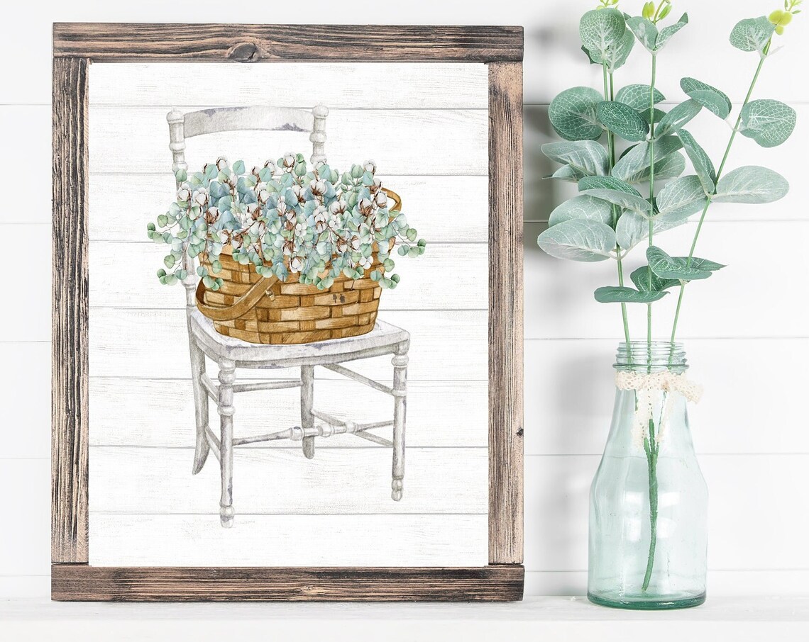 White Distressed Chair with Basket of Eucalyptus Stems Poster
