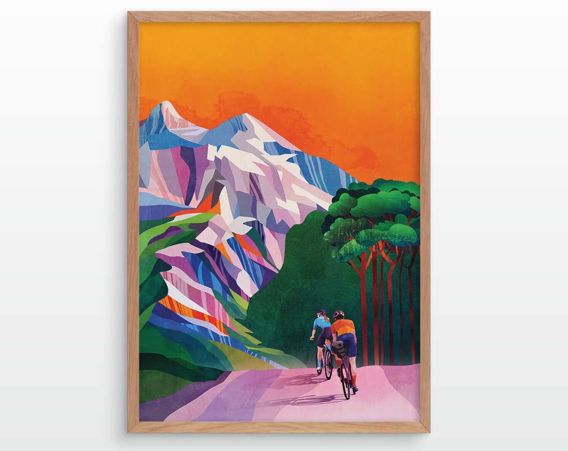 Cyclists Riding Toward Snowy Peaks at Sunset Orange Sky Poster