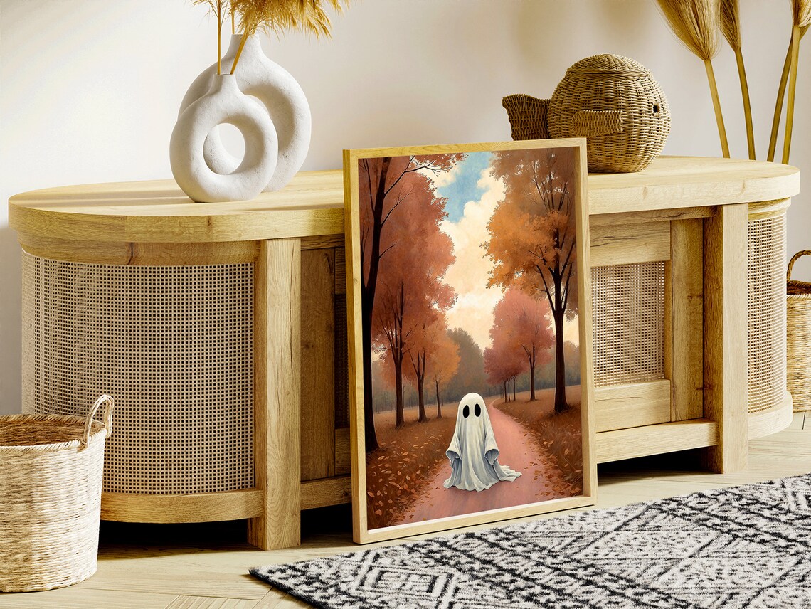 A Lone Ghost Strolling A Winding Path Through Blush Tone Autumn Woods Art Print - Image 2
