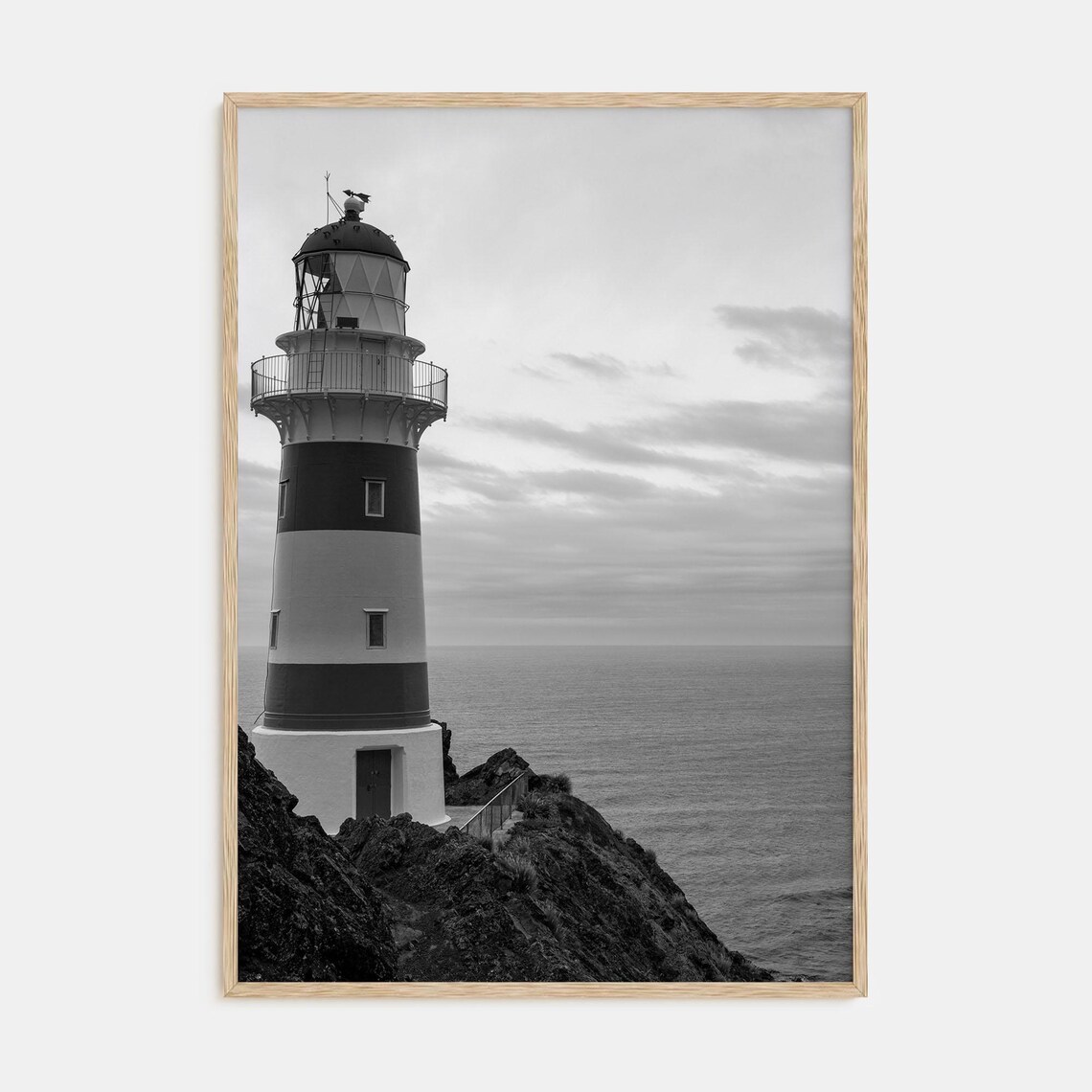 Striped Lighthouse on Rocky Cliff Black and White Photo Poster