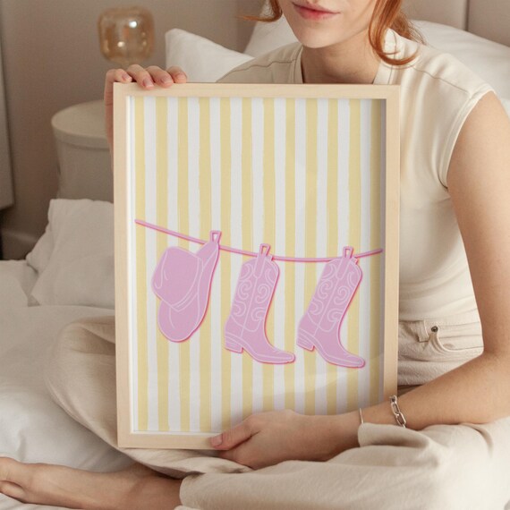 Pink Cowboy Boots and Hat on Yellow Striped Western Clothesline Poster