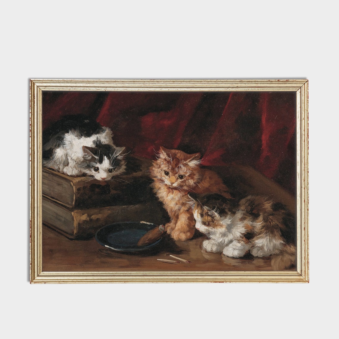 Three Kittens with Old Books and a Bowl on a Red Curtain Poster - Image 2