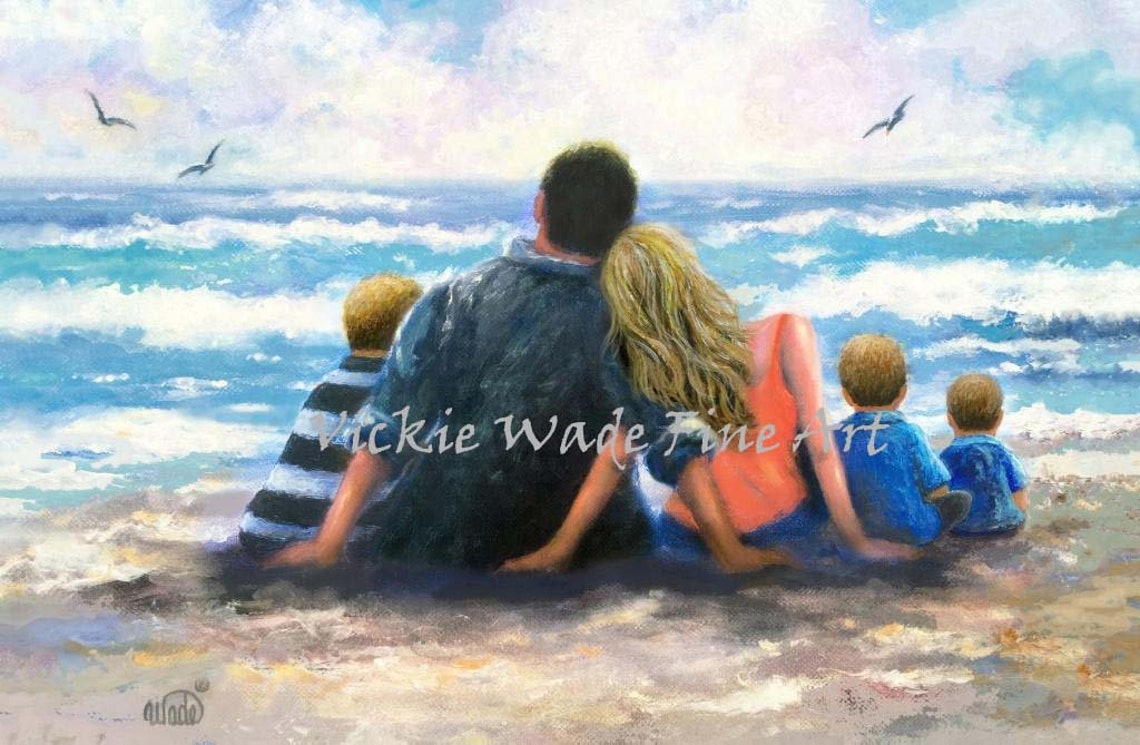 Parents and Three Young Sons Sitting Together on the Beach Poster