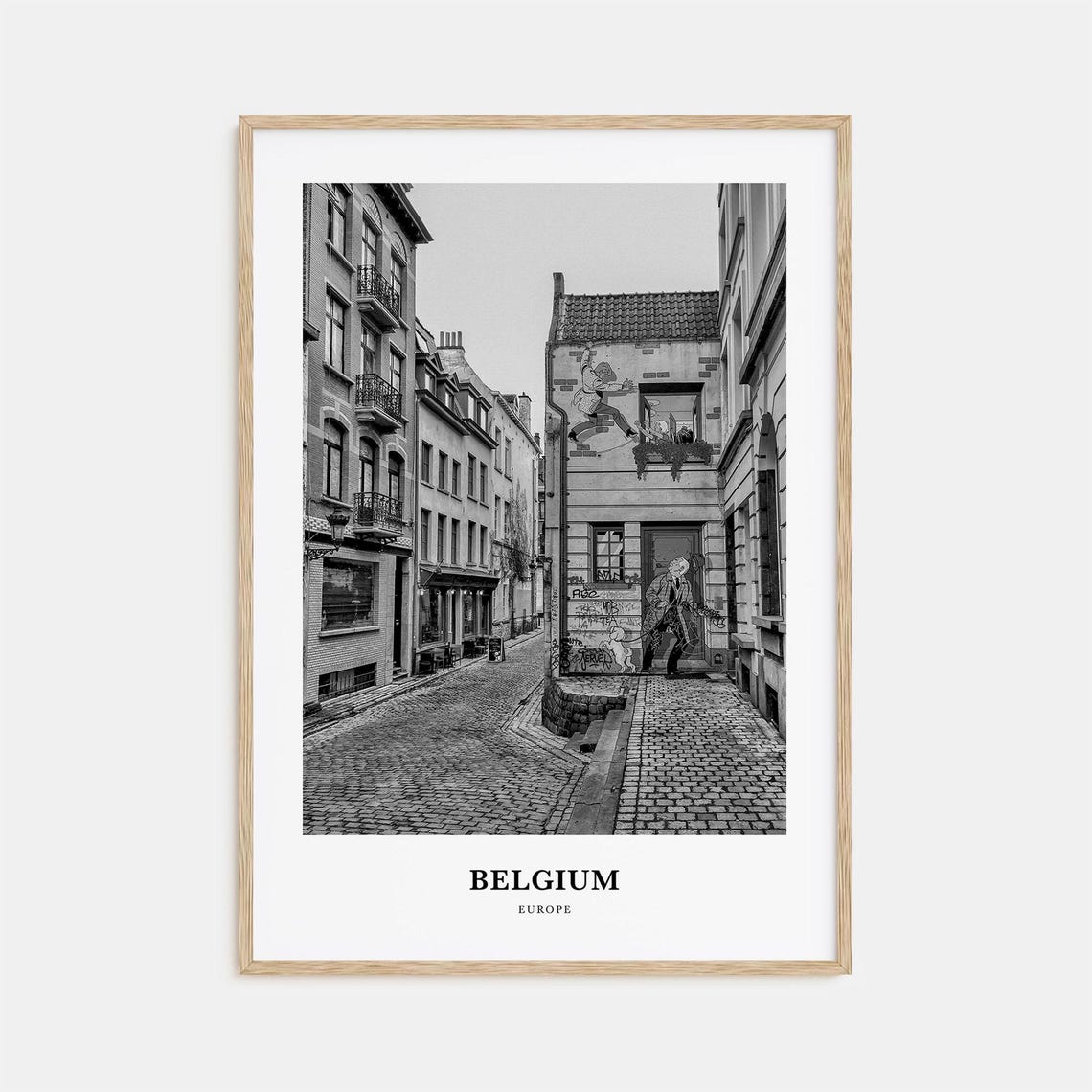 Belgian Cobblestone Street Adorned With Comic Wall Murals Poster