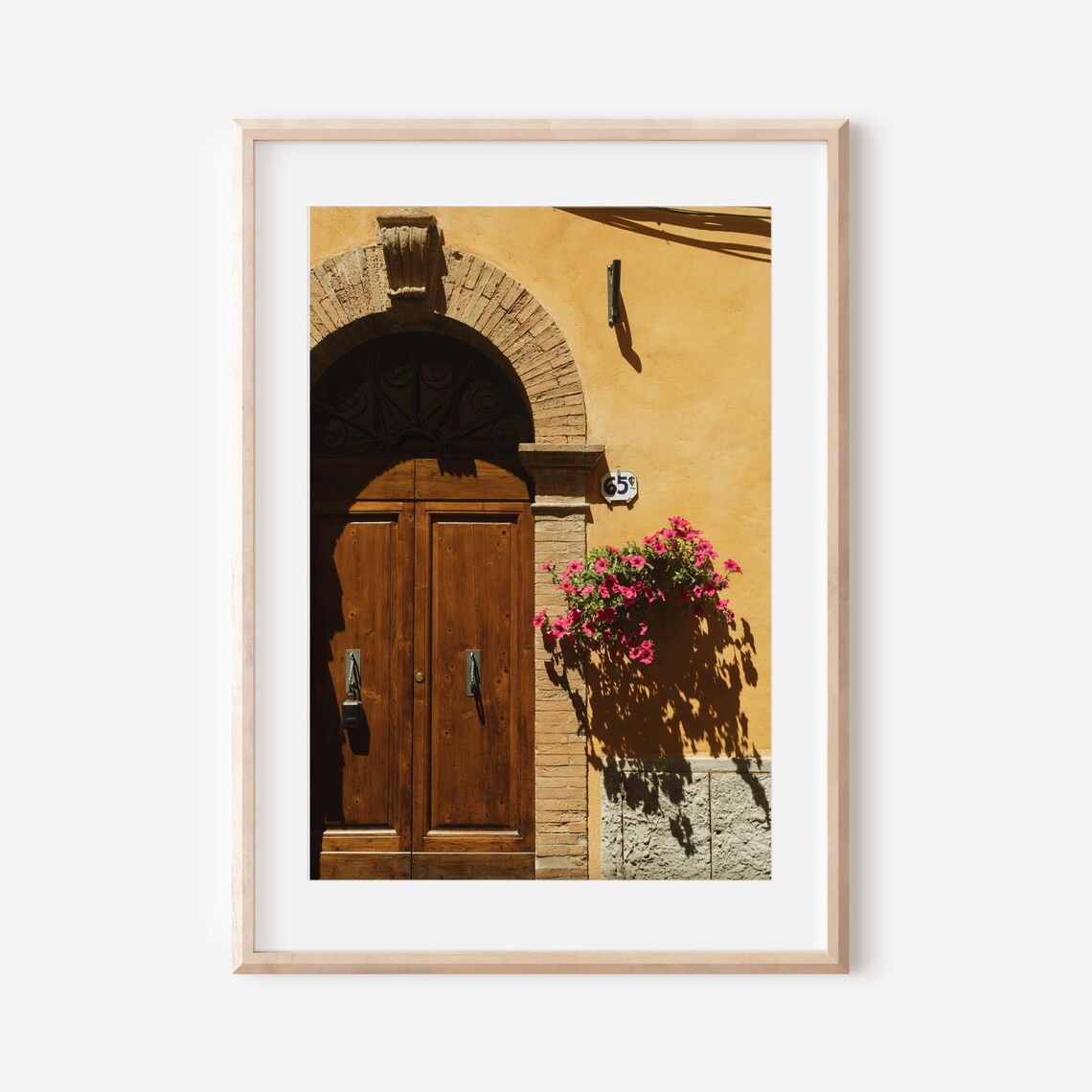 Tuscan Wooden Doorway with Pink Flowers on an Ochre Wall Poster