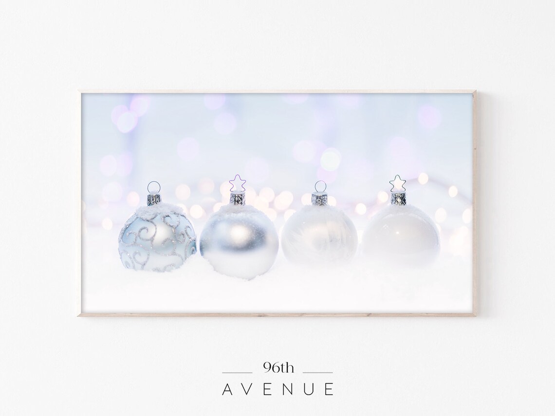 Silver White Christmas Ornaments in Snow With Bokeh Lights Poster